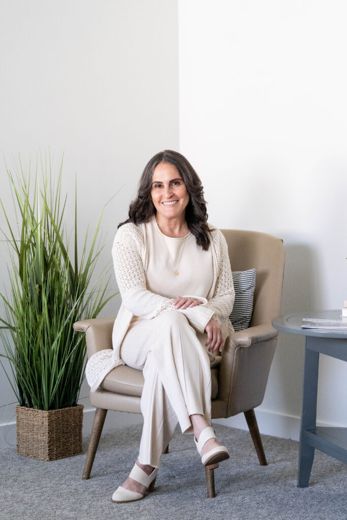 Photographer guiding client to feel natural and look like herself in brand photos